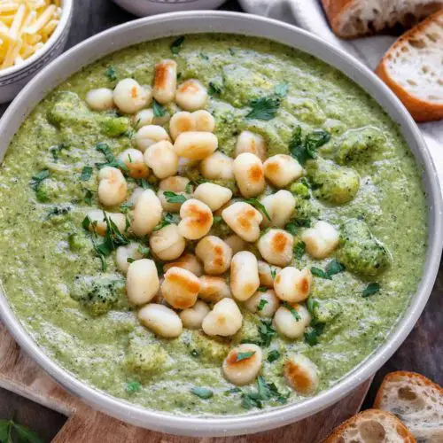 Creamy Broccoli Pesto Soup With Pan Fried Gnocchi recipe served in a bowl.