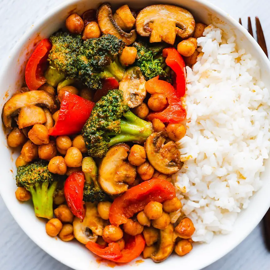 BBQ Chickpea Veggie Stir-Fry recipe served in bowl with rice.