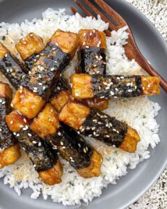 Nori Teriyaki Tofu Sticks recipe served on a plate with rice.
