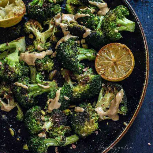 Oven-Roasted Broccoli with Pistachio Dukkah recipe served in a large bowl.