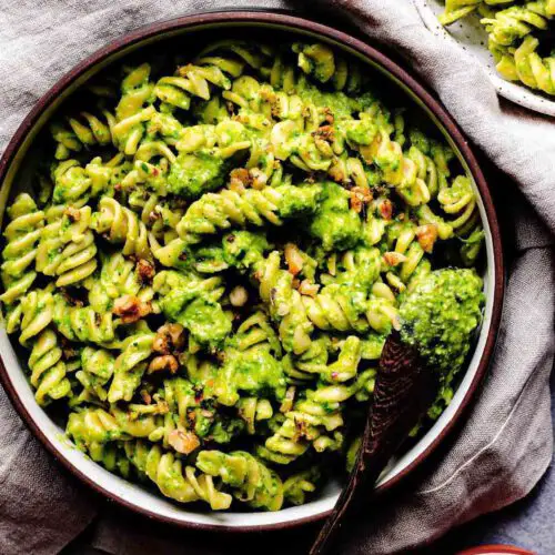 Broccoli Pesto Pasta with Lemon Sage Walnuts recipe served in a bowl.