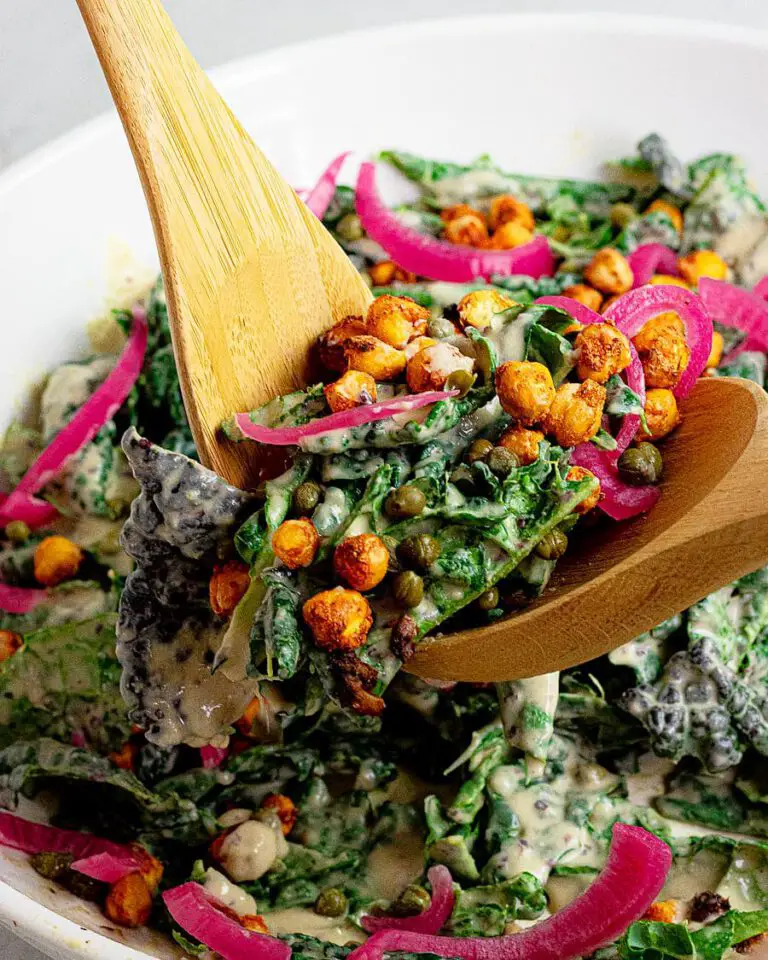 Kale Caesar Salad With Chickpea Croutons recipe served in a large bowl.