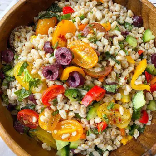 Rainbow Farro Salad recipe served in a large wooden bowl.