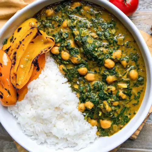Saag Chole Inspired Creamy Spinach and Chickpeas served in a bowl.