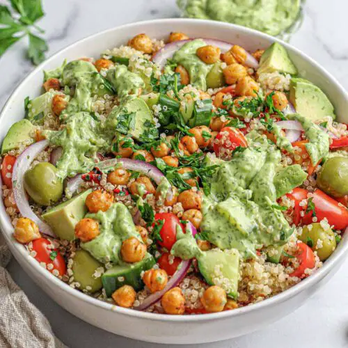 Quinoa Salad with Avocado Dill Dressing recipe served in a bowl with a dip on the side.