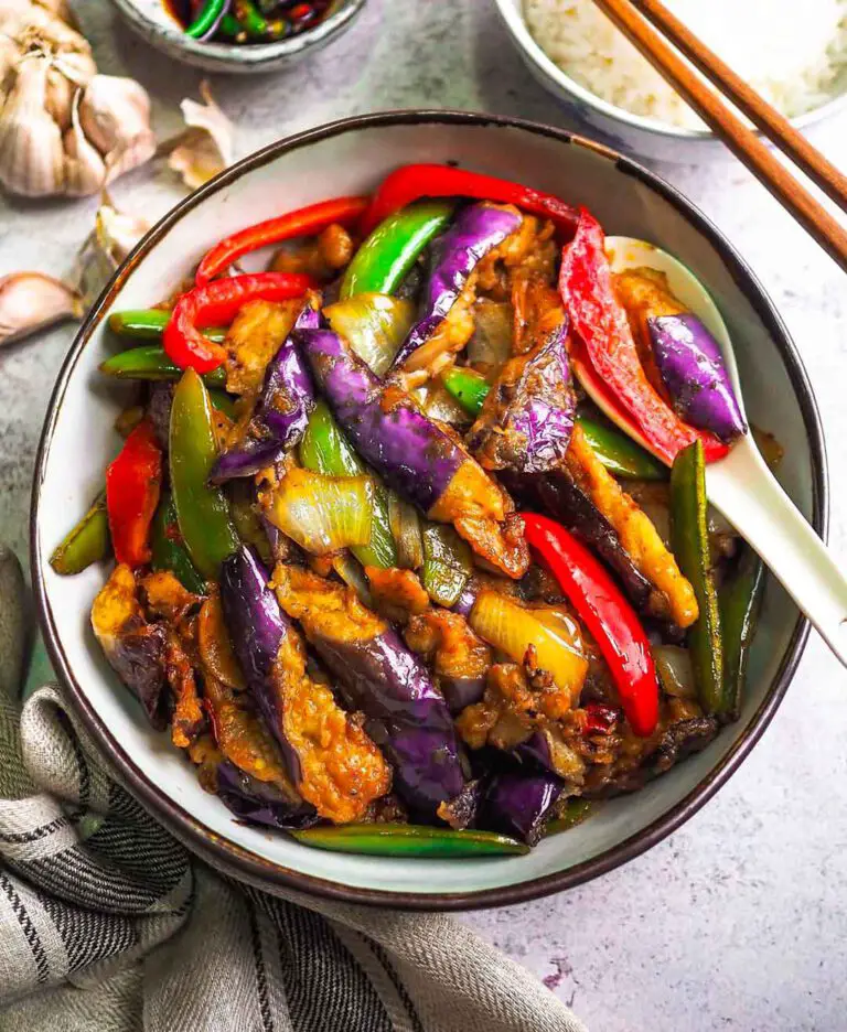 Easy Eggplant Stir Fry recipe served in a bowl with spoon.