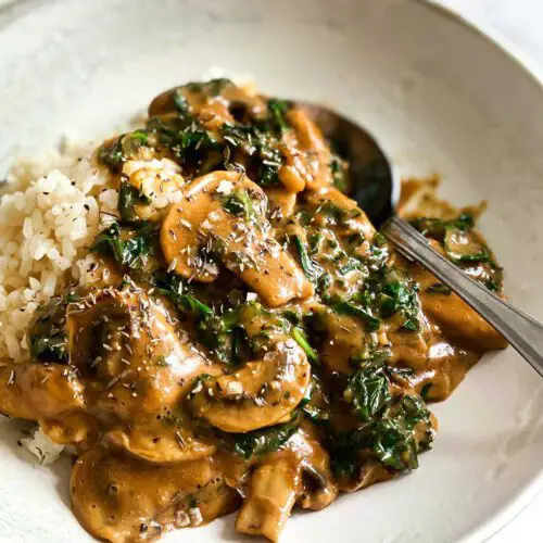 Mushroom & Kale Stroganoff recipes served in a bowl with spoon.