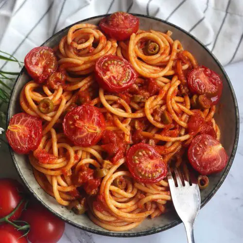 Slow Roasted Cherry Tomato Pasta recipe served in a bowl with spoon.