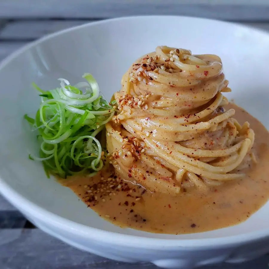 Spaghetti with Kimchi Cream Sauce recipe served in a bowl.