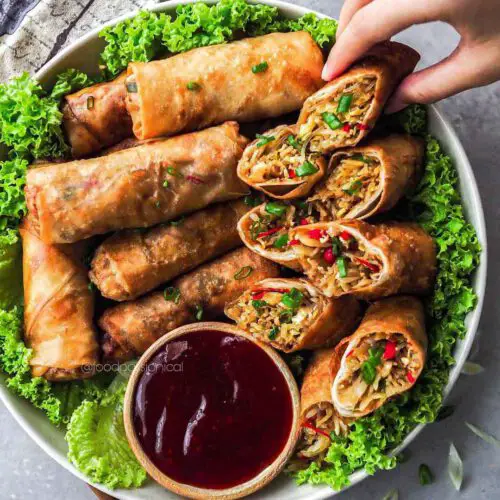 Vegan Fried Spring Rolls served on a plate with dipping sauce.