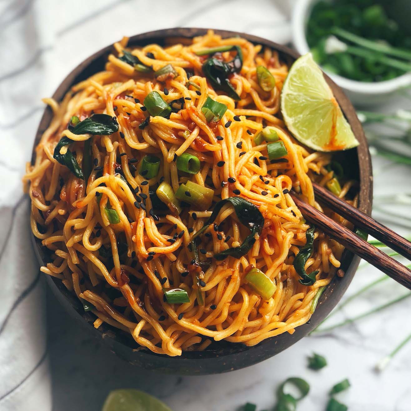 Vegan Singapore Noodles recipe displayed in a bowl with chopsticks