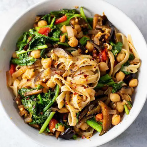 Spicy Eggplant and Kale Fettucine recipe served in a bowl.