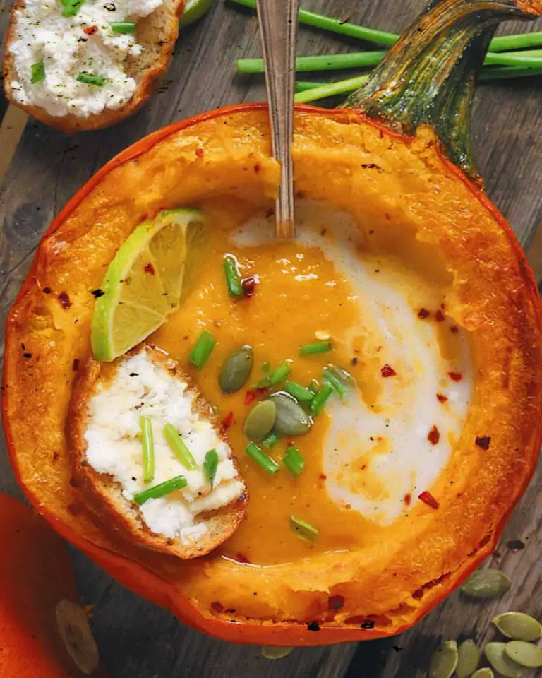 Roasted Thai Spiced Pumpkin & Leek Soup recipe served in a pumpkin with toast.