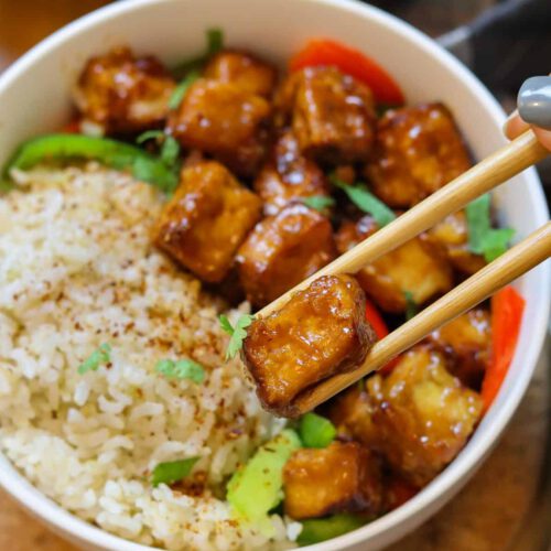 Miso Glazed Tofu recipe served in a bowl with rice and veggies.