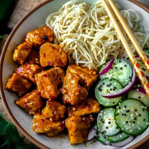 Sweet Chili Tofu and Cucumber Salad recipe served in a bowl.