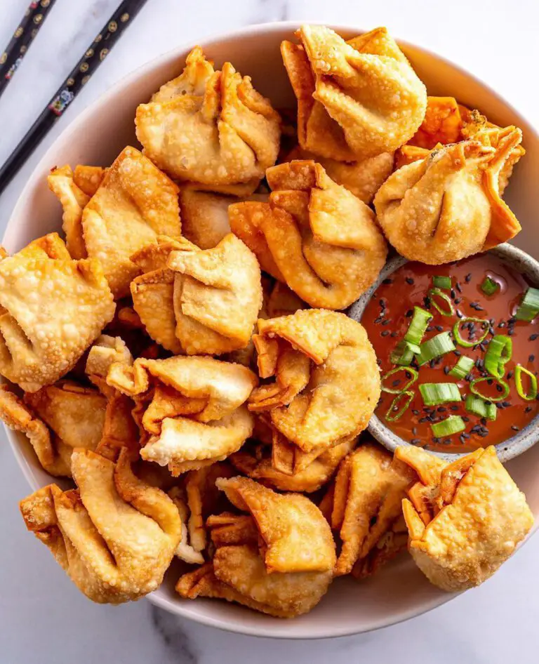 Vegan Krab Rangoon recipe served in a bowl with dipping sauce.