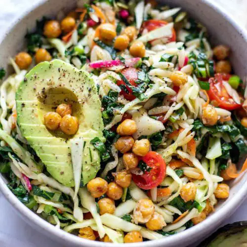 Vegan Winter Orzo Salad recipe served in a bowl with avacado.
