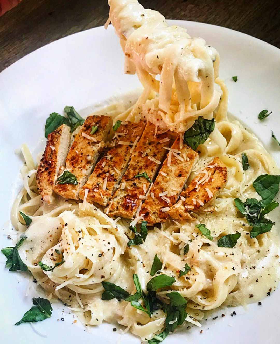 Creamy Chick'n Alfredo Pasta Bowl recipe served on a plate.