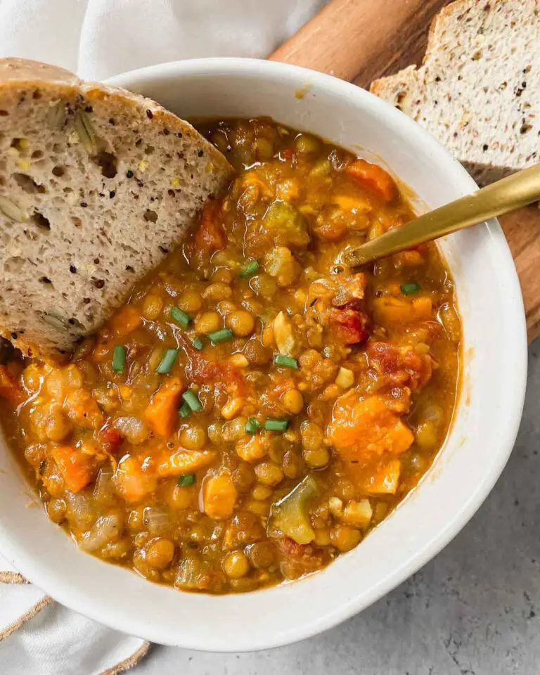 The Best Lentil Soup recipe served in a bowl with bread.